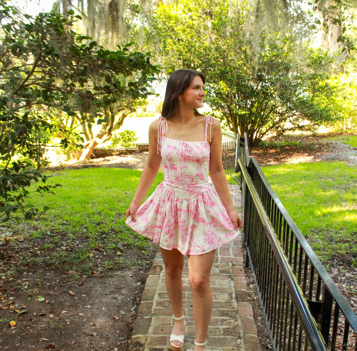 Floral pink summer dress with adjustable straps, perfect for outdoor events and casual wear.