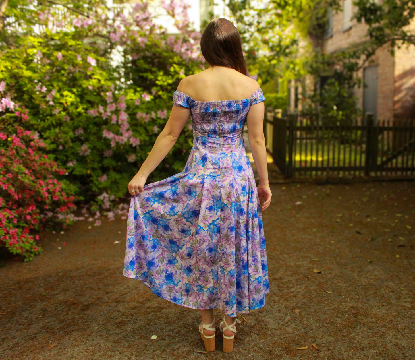 Off-shoulder floral maxi dress in purple and blue, lightweight fabric perfect for spring outings.