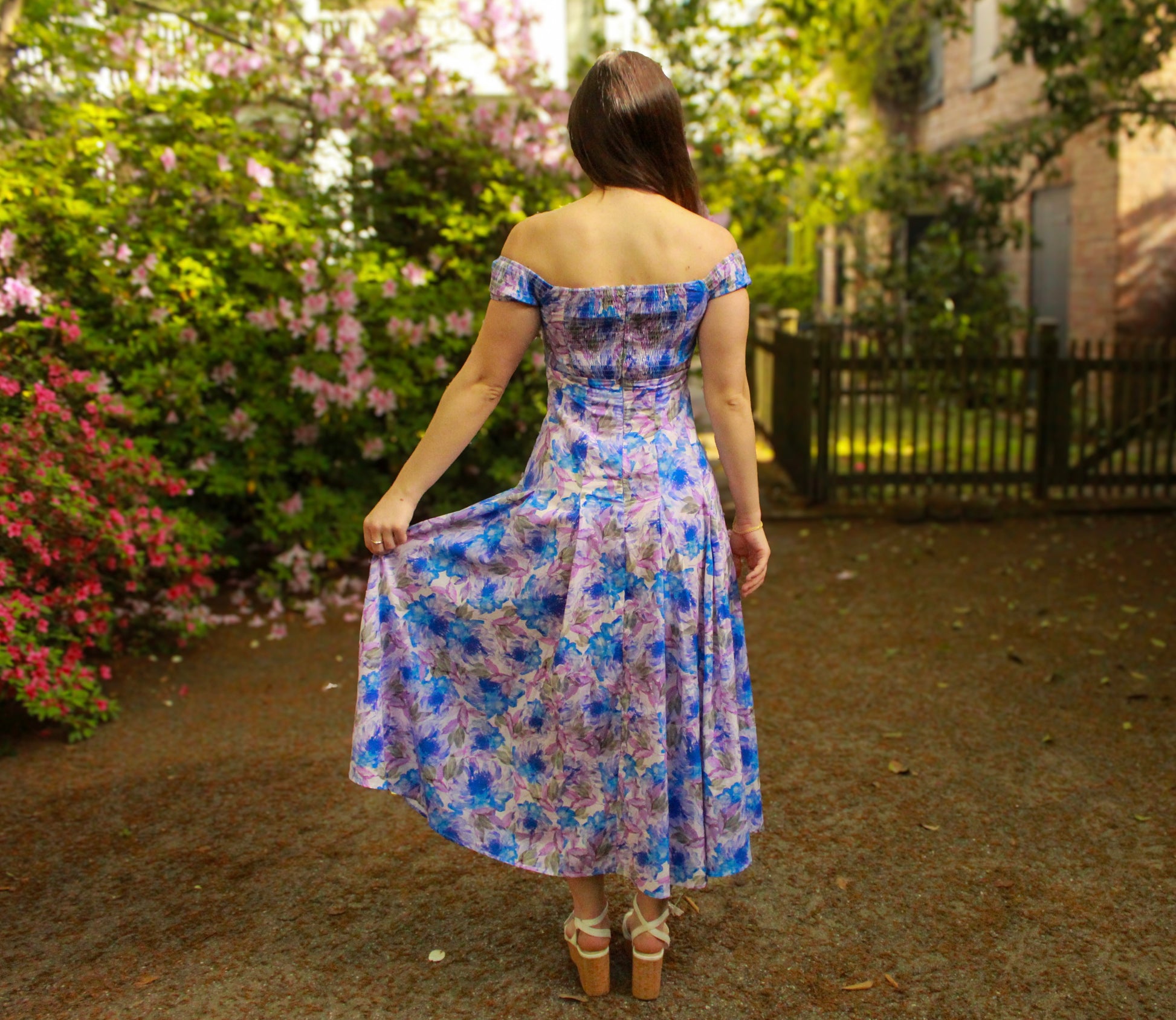 Off-shoulder floral maxi dress in purple and blue, lightweight fabric perfect for spring outings.