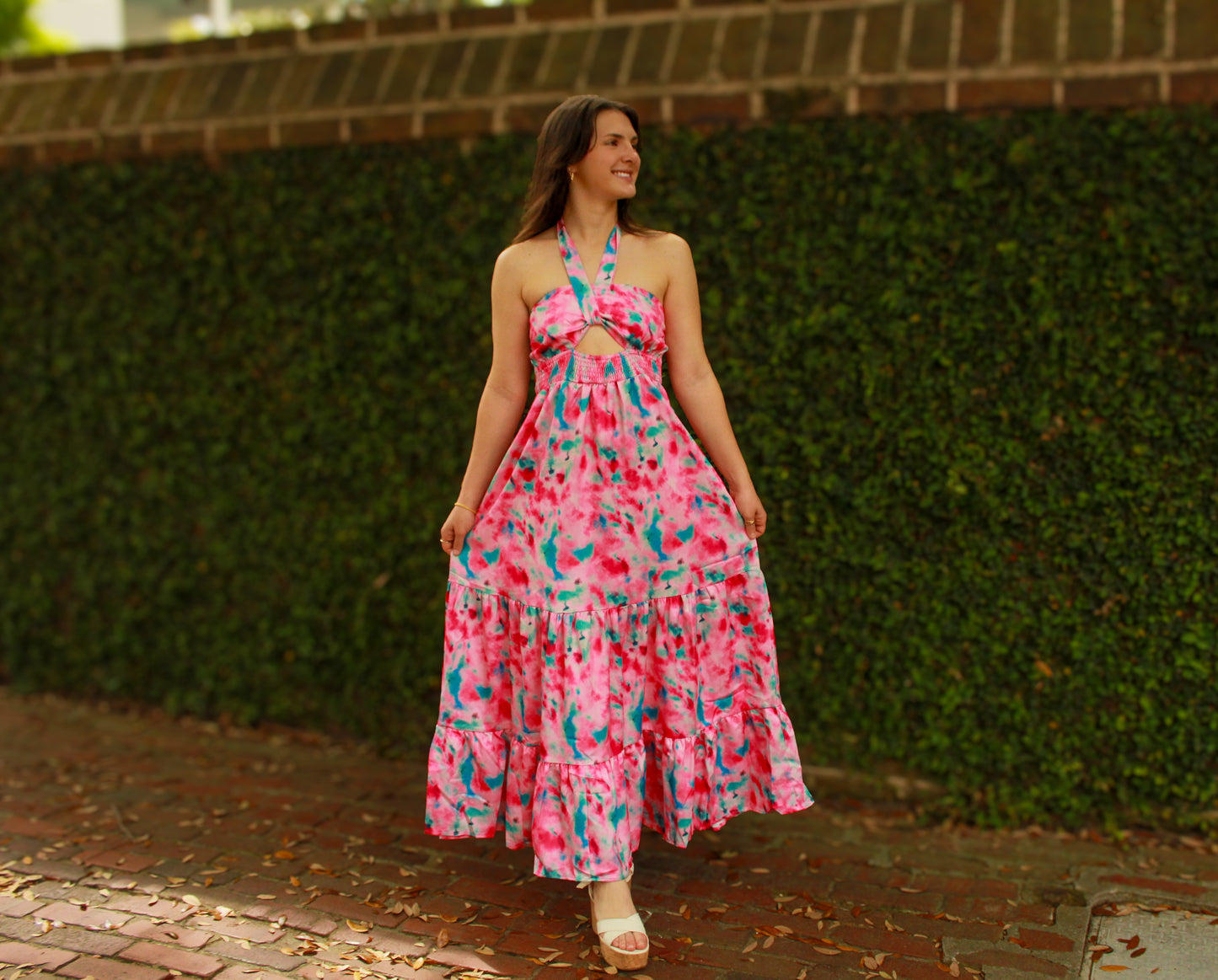 Vibrant pink and blue tie-dye maxi dress with a halter neckline and ruffled hem, perfect for summer.