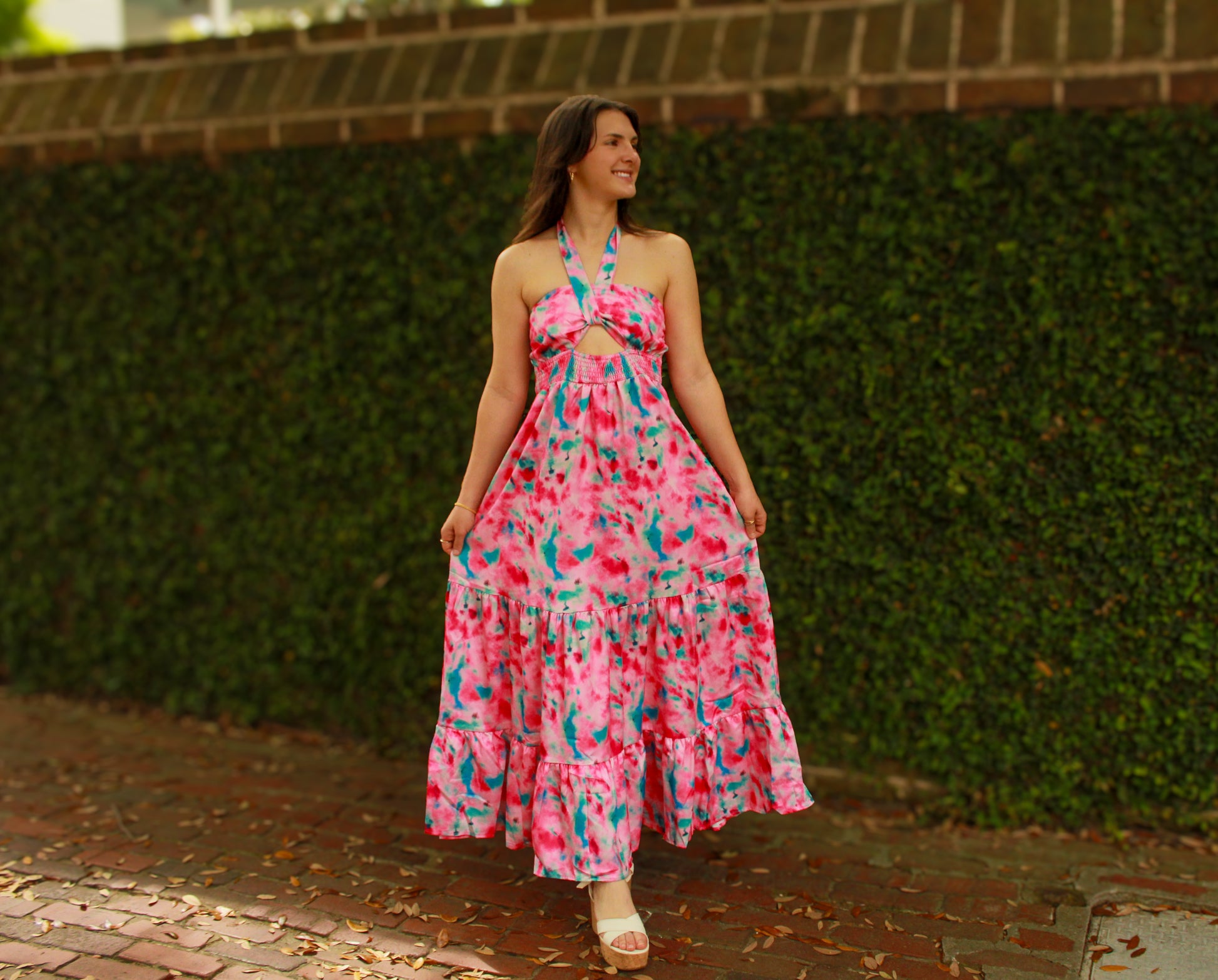 Vibrant pink and blue tie-dye maxi dress with a halter neckline and ruffled hem, perfect for summer.