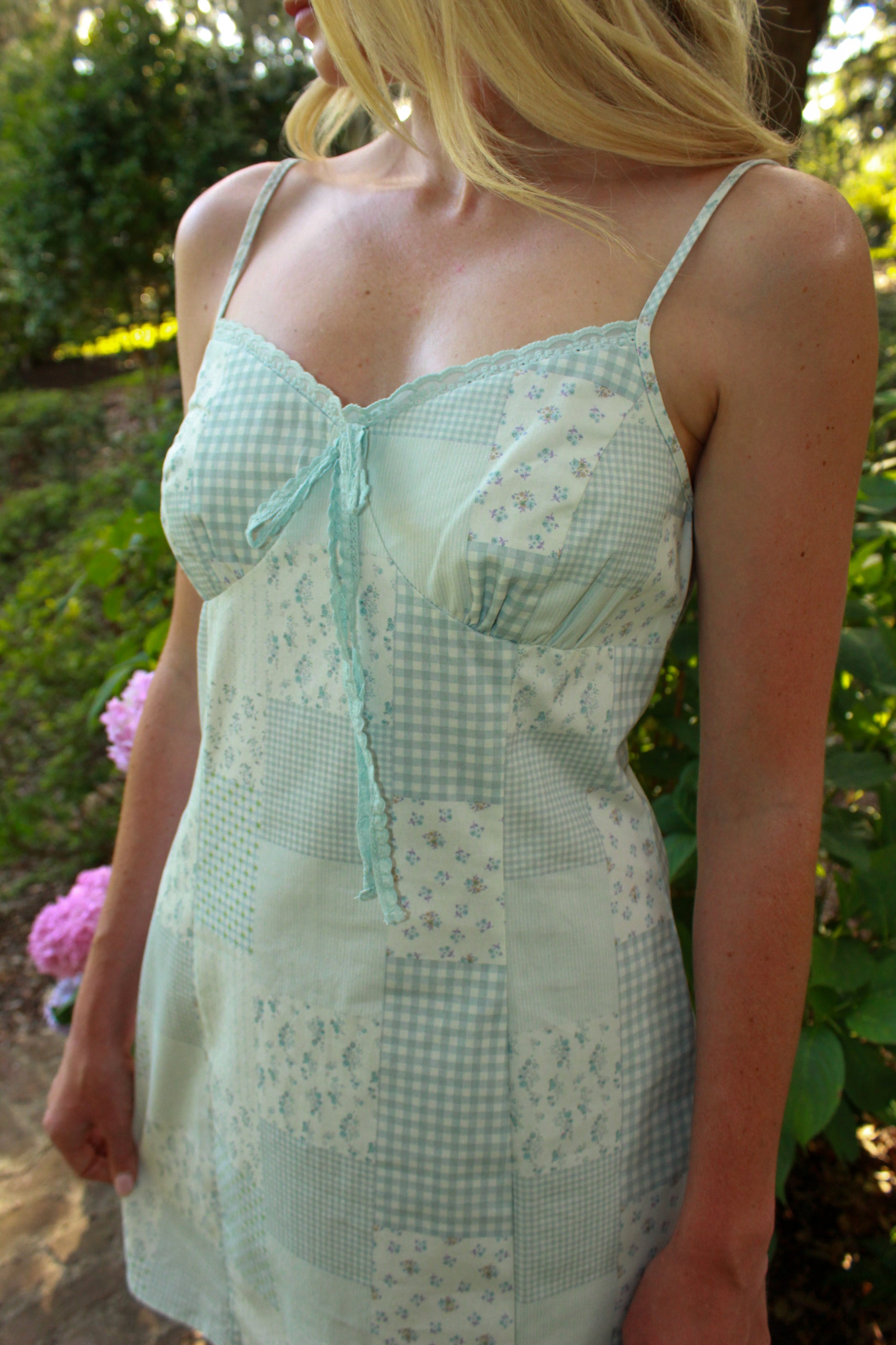 Light blue patchwork nightgown with floral design and lace trim, perfect for relaxed evenings.
