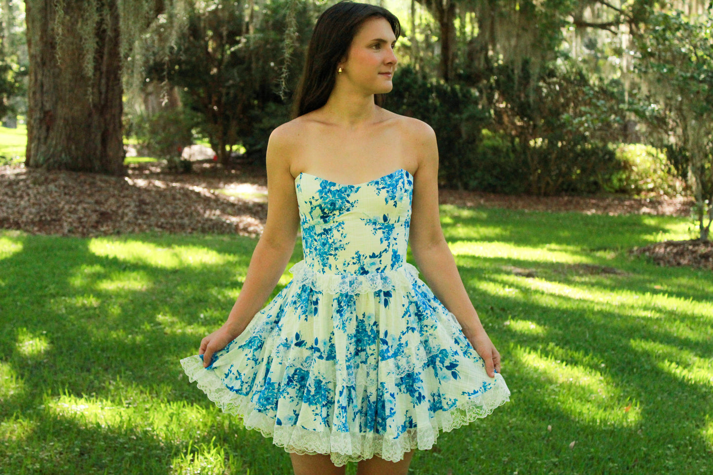 Floral strapless mini dress, blue and white, lace trim, perfect for summer outings and casual events.