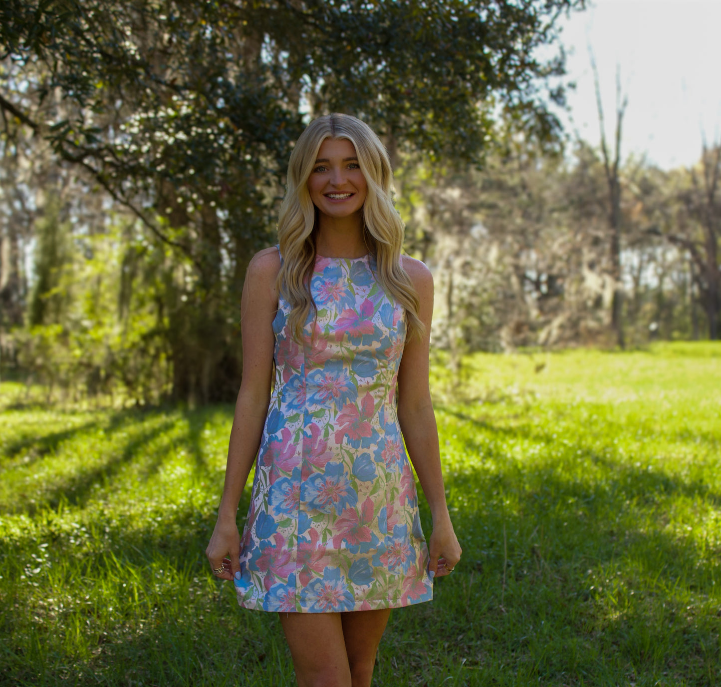 Floral print sleeveless dress in pastel colors, perfect for spring and summer outings.