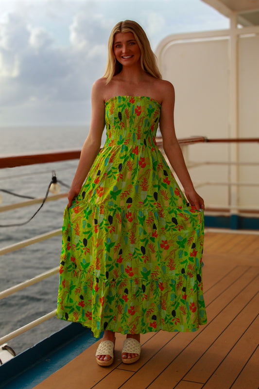 Strapless green floral maxi dress with smocked bodice, perfect for summer outings and vacations.