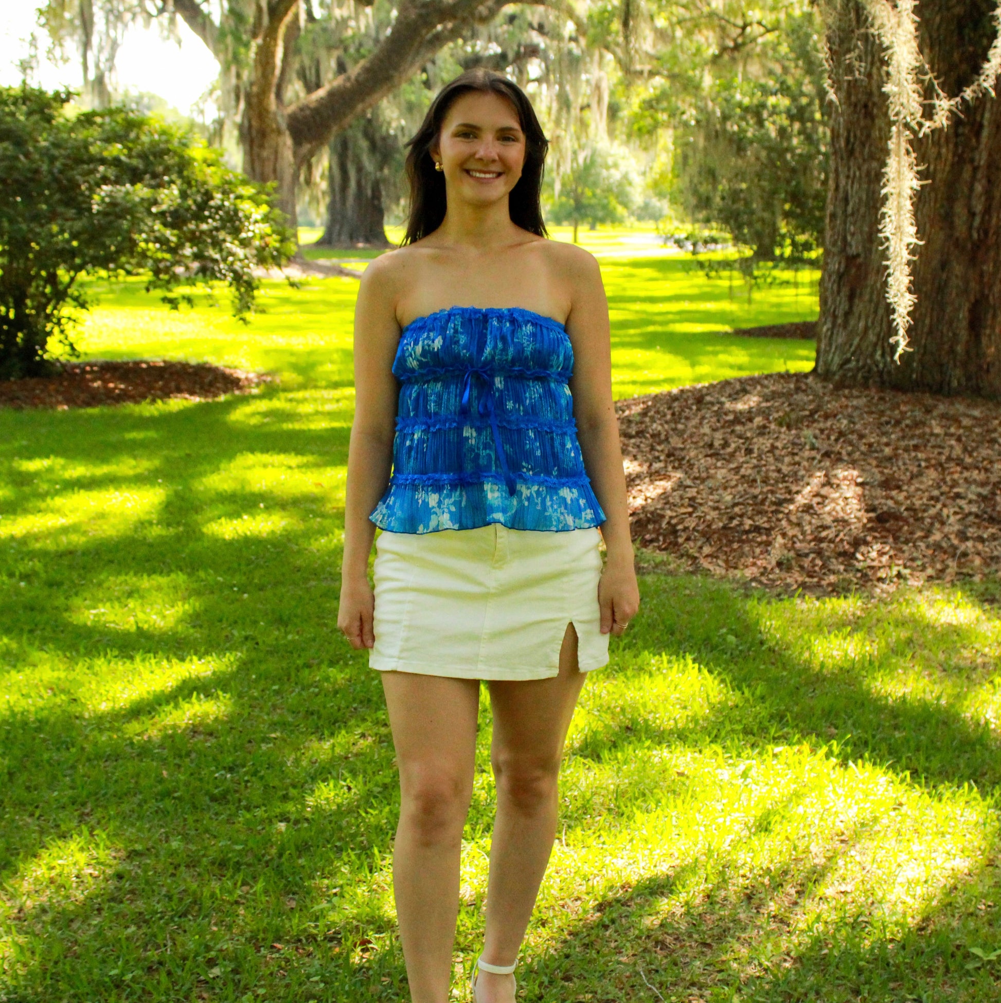 Blue strapless peplum top made from lightweight fabric, perfect for summer outfits.