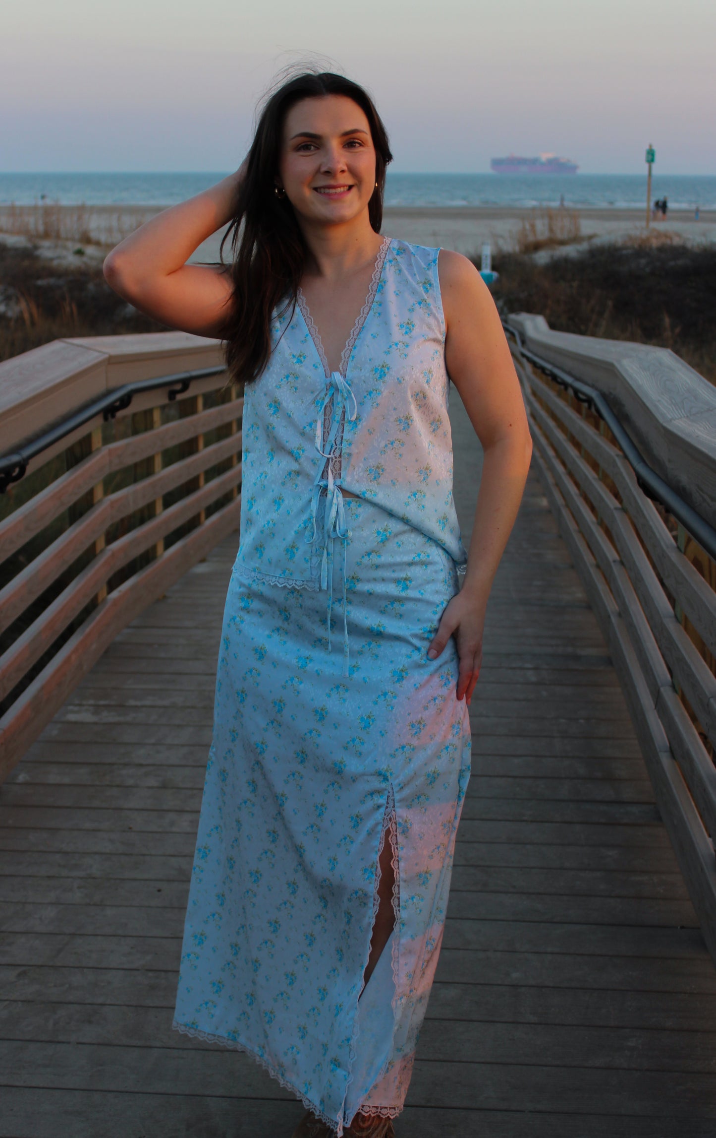 Light blue floral maxi dress with a slit, perfect for beach outings, made of soft, breathable fabric.