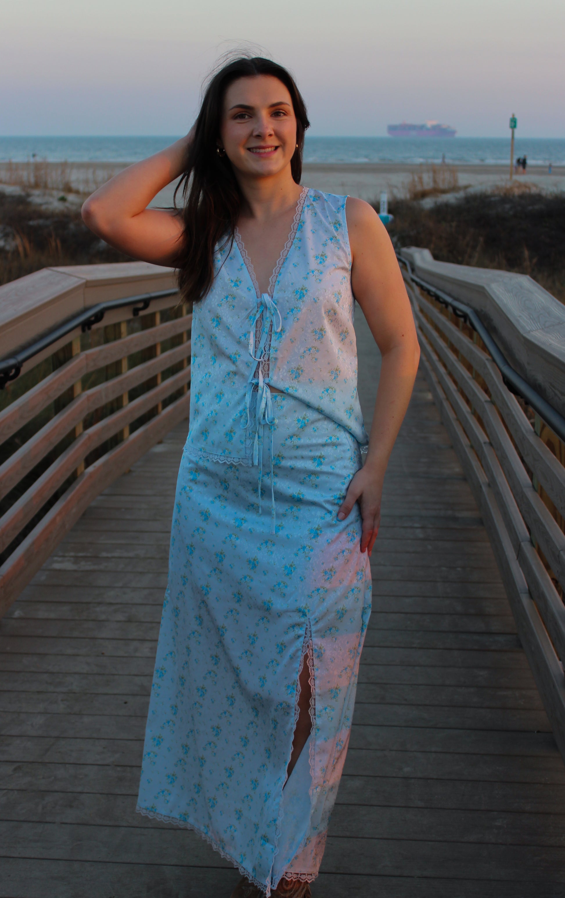 Light blue floral maxi dress with a slit, perfect for beach outings, made of soft, breathable fabric.