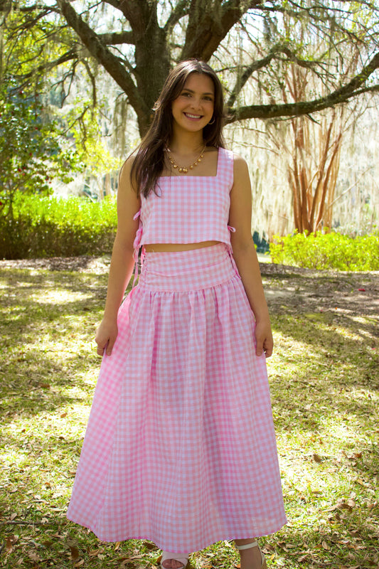 Pink gingham two-piece crop top and maxi skirt set made of lightweight cotton, perfect for summer outings.