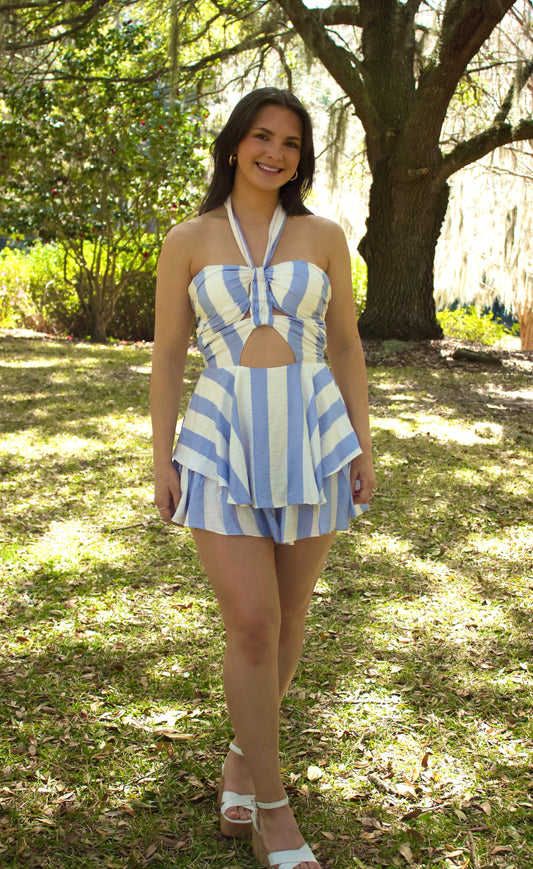 Blue and white striped halter dress with cutout, perfect for summer days outdoors.